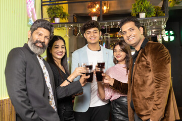 Indian people enjoying party at restaurant.