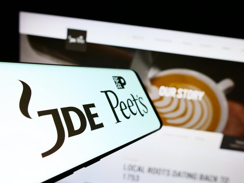 Stuttgart, Germany - 08-05-2023: Smartphone with logo of beverage company JDE Peet's NV on screen in front of business website. Focus on center-left of phone display.