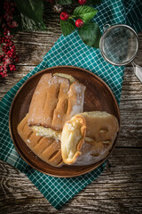 Sweet buns with cheese on wooden table.