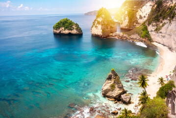 Fototapeta na wymiar Tropical beach with white sand and palm trees, beach holiday destination on Bali island