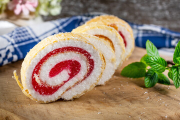 Slices of homemade sweet roll with fruit jam.