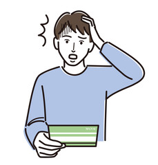 通帳を見て頭を抱える男性