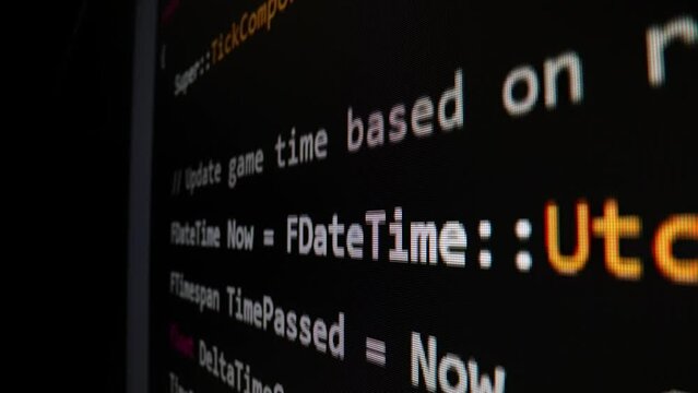 Closeup macro shot movement of coding script moving across LED screen with real-time AI-generated typing, showcasing advanced AI learning in optimization, debug and coding for software development.