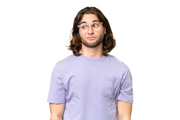 Young handsome man over isolated background making doubts gesture looking side
