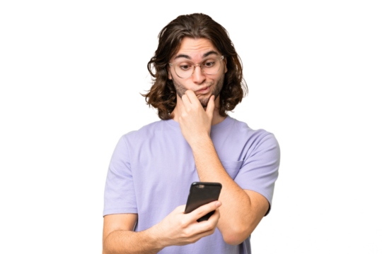 Young handsome man over isolated background thinking and sending a message