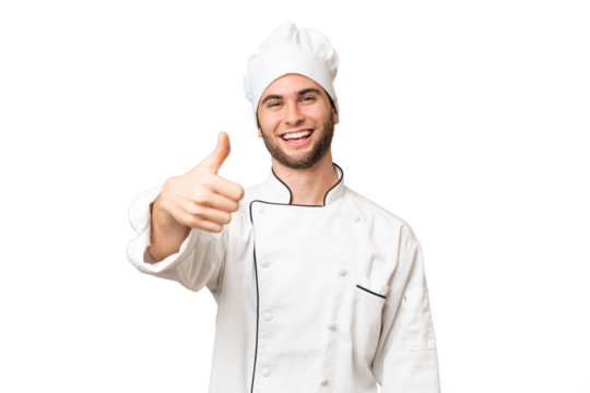 Young handsome chef man over isolated background with thumbs up because something good has happened