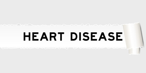 Ripped gray paper background that have word heart disease under torn part