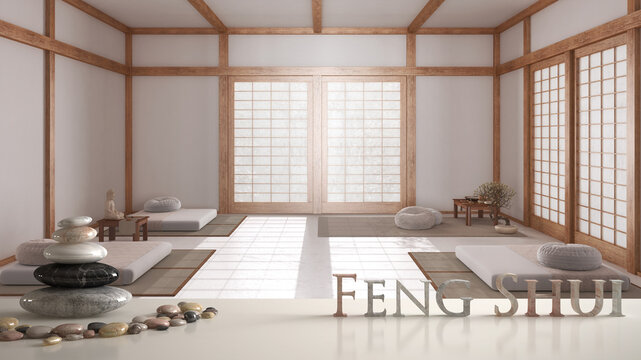 White table shelf with pebble balance and 3d letters making the word feng shui over minimal meditation room in japanese style, zen concept interior design