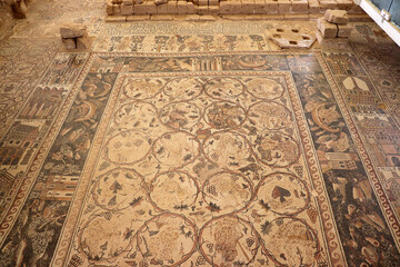 An ancient, archeological mosaic inscription from the Roman era, located in the Jordanian Arab governorate of Madaba in the Middle East