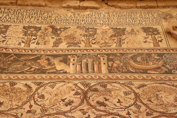 Fototapeta na wymiar An ancient, archeological mosaic inscription from the Roman era, located in the Jordanian Arab governorate of Madaba in the Middle East