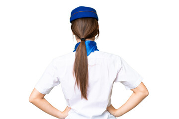 Airplane stewardess over isolated chroma key background in back position