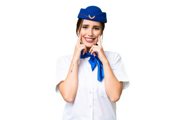 Airplane stewardess over isolated chroma key background smiling with a happy and pleasant expression