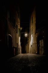 Romantic historic old town of Malcesine on Lake Garda in Italy with narrow streets at night - 633774857