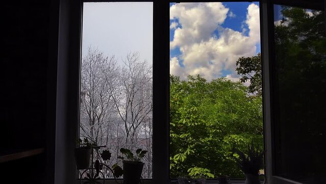 Home window frame with two windows, one of which has a summer landscape and the other a winter one. Choice concept. Creative 4k time lapse video.