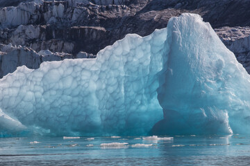 Close shot of blue iceberg with veined bubble pattern