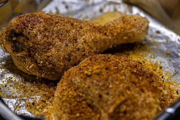 Raw seasoned chicken thigh and leg.