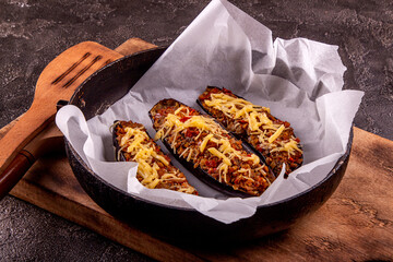 Arabic recipe stuffed eggplants with red lentils, chicken meat, tomato, onion and cheese.