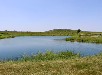 The quiet country lake on a sunny day.