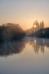 Obraz premium sunrise over the river in Montrichard Val de Cher in France
