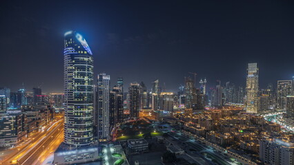 Fototapeta na wymiar Panorama showing Dubai Downtown and business bay night with tallest skyscraper and other towers