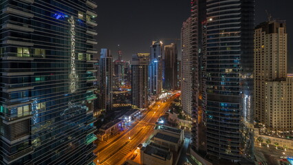 Fototapeta na wymiar Panoramic view of the Dubai Marina and JBR area aerial night timelapse