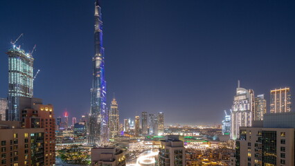 Fototapeta na wymiar Dubai Downtown cityscape with tallest skyscrapers around aerial day to night timelapse.