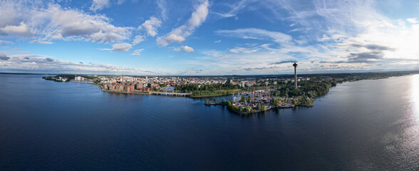 Aerial panorama of Tampere above a lake - obrazy, fototapety, plakaty