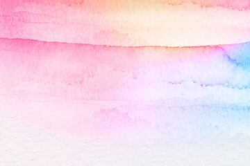 Fototapeta premium Colorful watercolor background of abstract sunset sky with puffy clouds in bright rainbow colors of pink green blue yellow and purple. Abstract painting banner for web and composition
