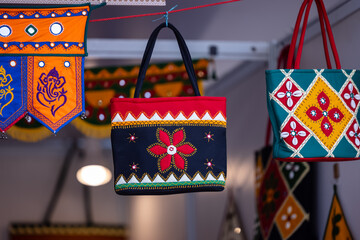 Interior decoration, Handmade colorful hanging ladies purse items for decoration display at shop.