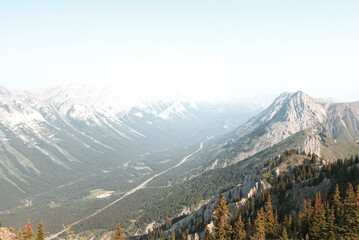 Views of mountains, forests and a major highway on a summers day in Kananaskis Country, Alberta, Canada from on top of King Creek Ridge