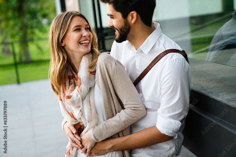 Wall mural young loving couple hugging and enjoying time together.