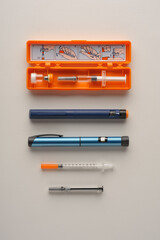 set of various insulin syringe pens and injections for diabetes