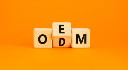 OEM or ODM symbol. Concept word OEM ODM original design equipment manufactirer on wooden block....