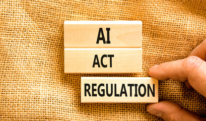 AI act regulation symbol. Concept words AI artificial intelligence act regulation on wooden block. Beautiful canvas background. Businessman hand. Business AI act regulation concept Copy space - obrazy, fototapety, plakaty