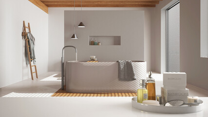 Spa, hotel bathroom concept. White table top or shelf with bathing accessories, toiletries, over japandi minimalist bathroom, modern architecture interior design