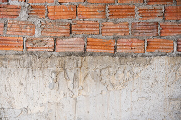 Bricks wall and cement background.Red grunge brick wall texture.Empty construction site.
