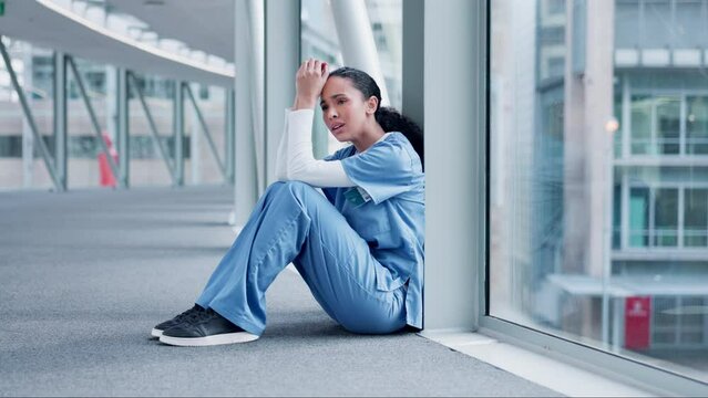 Death, stress or sad woman surgeon in hospital grieving loss, operation failure or crying for bad news. Depression, floor or tired doctor frustrated by fatigue, burnout or anxiety thinking of mistake