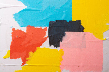 Close-up of scraps of paper of various colors.