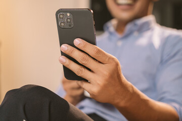Man working on laptop on white table at office. At night