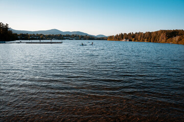 sunset in the mountains in a town lake with blue 