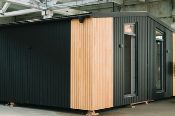 Exhibition of new and modern prefabricated modular house from composite wood panels. Energy...