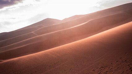 desert with cloudy sky during sunset