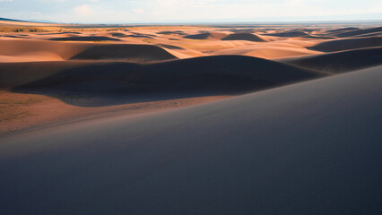 desert with cloudy sky during sunset