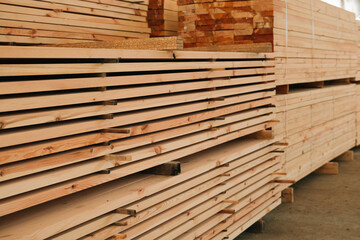 Stacks of lumber being stored in a warehouse