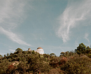 Griffiths Observatory peaking over the hills of Los Angeles.