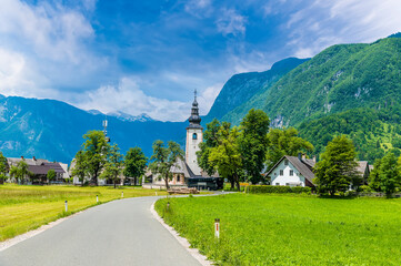 A view towards the alpine village of Stara Fuzina above lake Bohinj in Slovenia in summertime