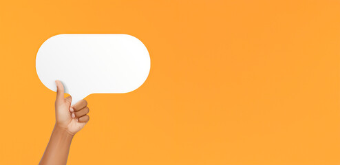 Expressive Communication: Human Hand Raises Paper Speech Bubble Against Orange Backdrop.