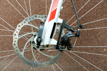 Brake disc of a mountain bike in close-up. Cycling for fun and health. Active leisure. A new bike...