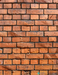Fototapeta premium red brick wall in the historical part of the old city in europe as a background 7