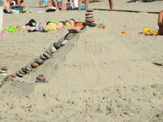 pyramid made of sand on the beach
